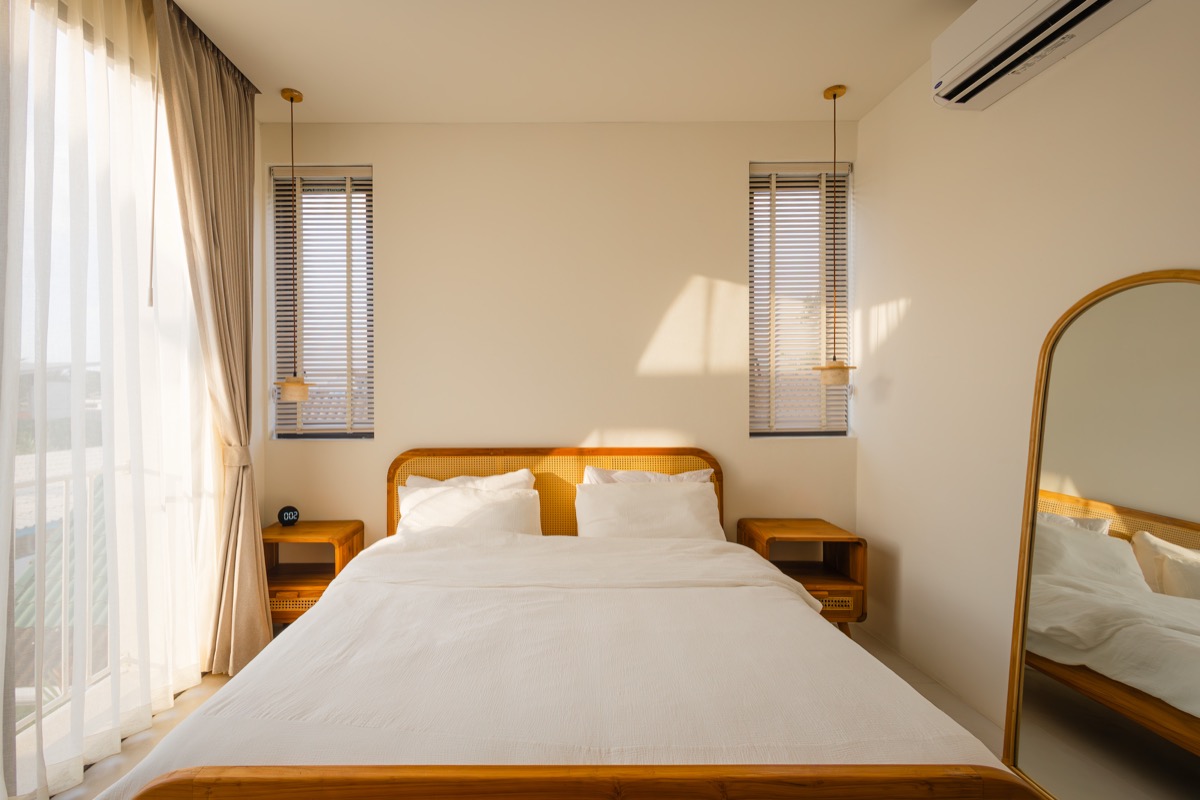 Sunlit bedroom with rattan bed